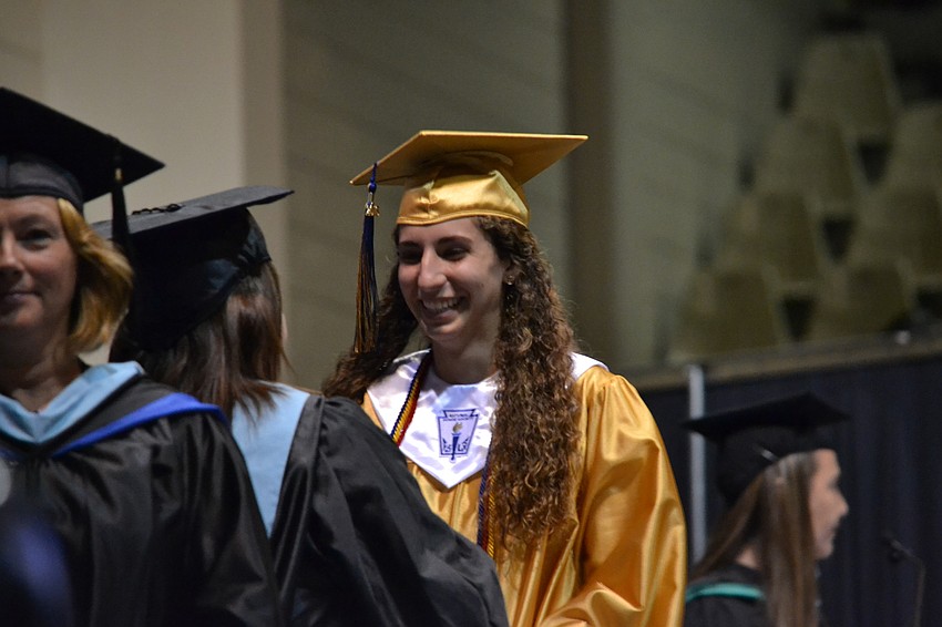 Vada Hammons receives her diploma.
