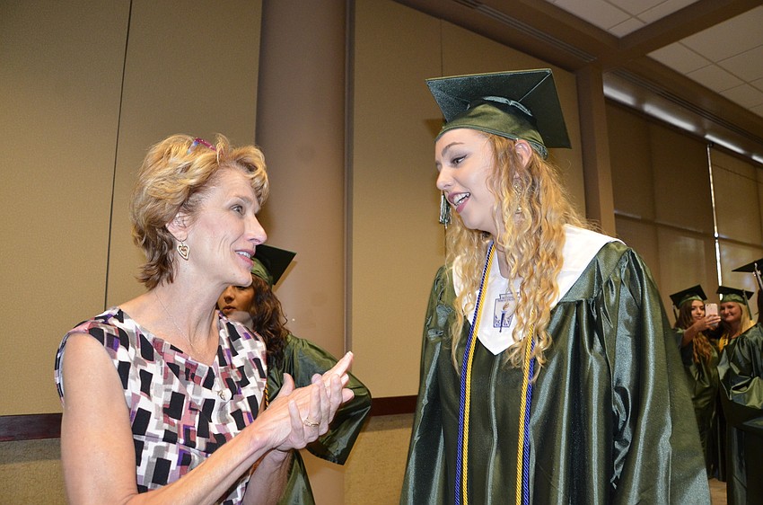 Darla Walker talks with Siobhan Morley, who was an office aide with Walker this year.