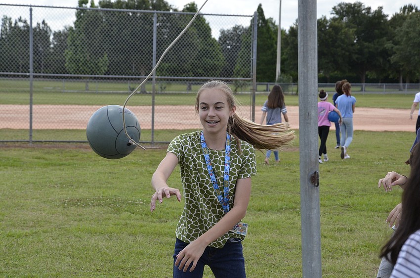 Maya Lander plays tetherball with her friends.