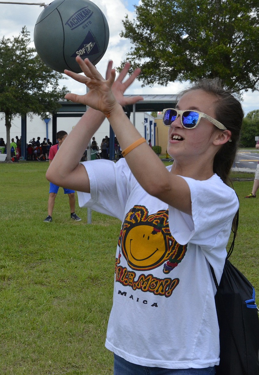 Olivia D'Orazio tries to keep the ball from getting around the pole.