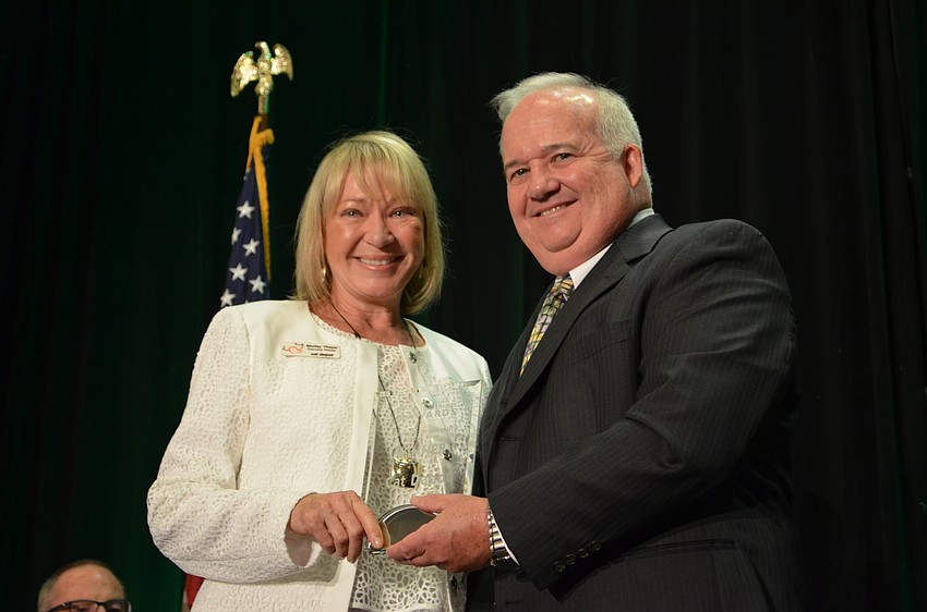 Cat Depot Executive Director Shelley Thayer accepts the award for Non-Profit Organization of the year.