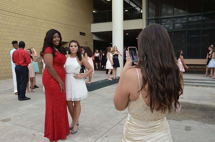 Emily Byrd snaps a photo for Miah Lowman and Taylor Harvey.