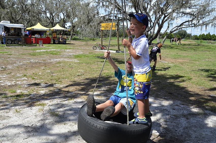 Mason and William Kringle of Port Charlotte take a swing.