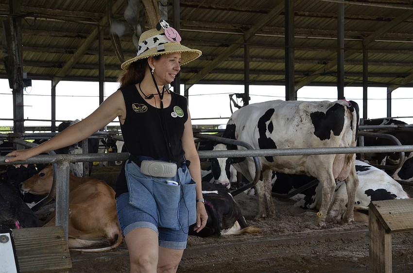 Kim Smith leads a farm tour and tells her followers about the farm and its operations.