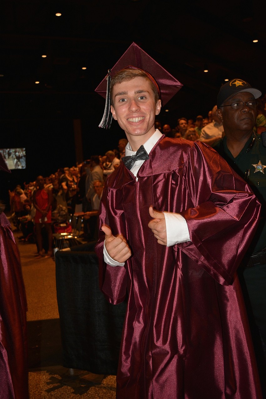 R.J. Brown gives a thumbs up as he spots his parents, Rick and Debbie, in the crowd.
