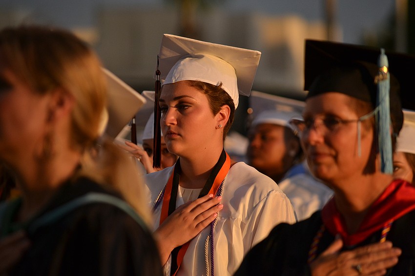 Amanda Alvarez gives her attention to the performance of the national anthem.