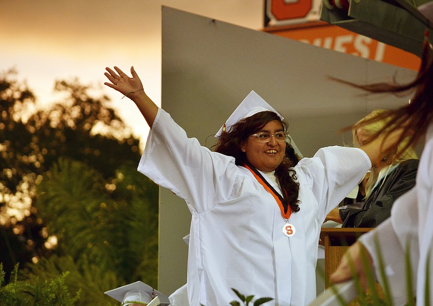 Jennifer Castillo celebrates her walk across the stage to her diploma.