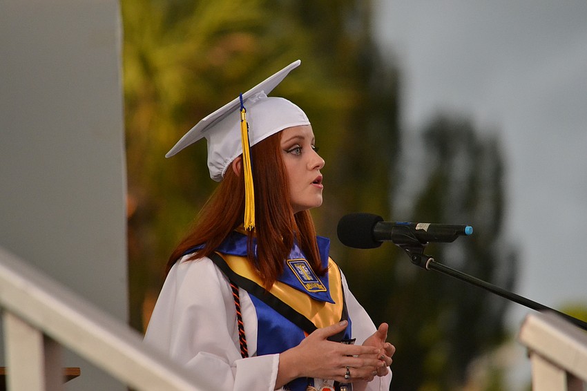 Rosemarie Messina-Adam performs the national anthem to start the commencement ceremony.