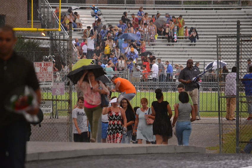 The outdoor commencement ceremony was cut short due to a storm.