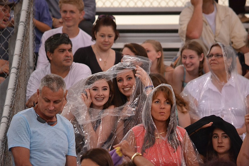 Family and friends donned ponchos to stay dry during the Sarasota High School Commencement Ceremony Friday, June 3.