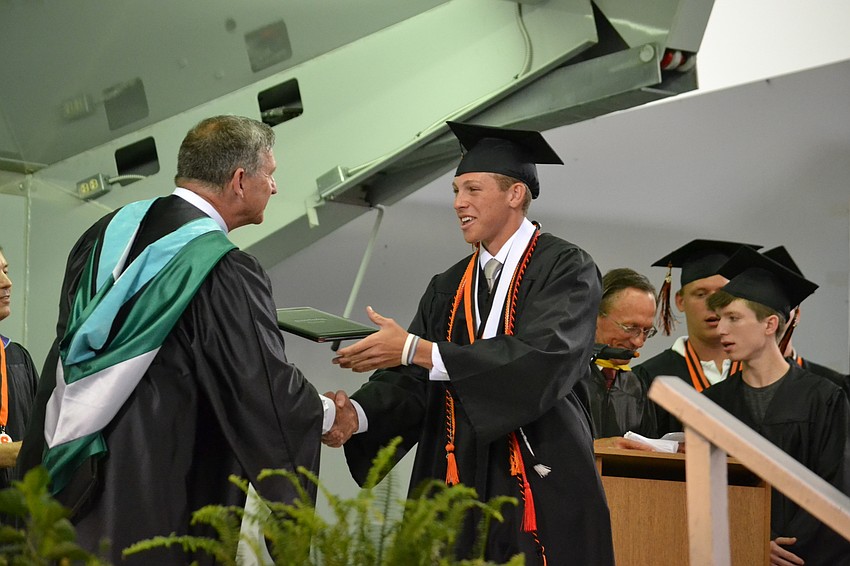 Vaun Brown receives his diploma.