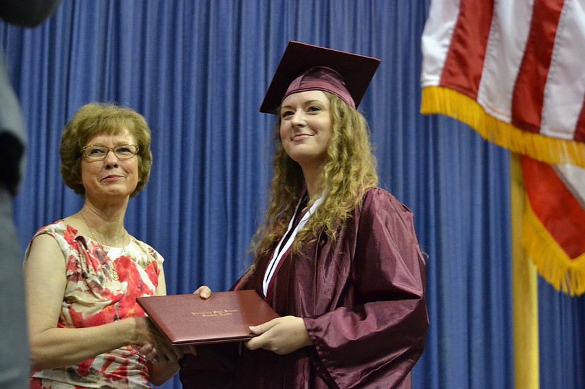 Sarasota County Schools Superintendent Lori White gives Brianna Thomas her diploma.