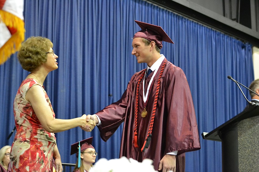 Sarasota County Schools Superintendent Lori White congratulates Tyler Gieson.