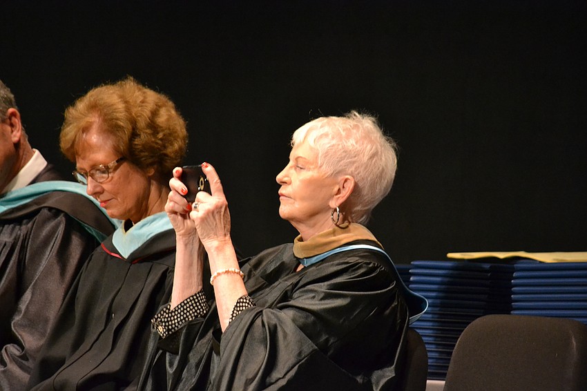 Sarasota County School Board member Caroline Zucker takes in the crowd from her seat on the stage.