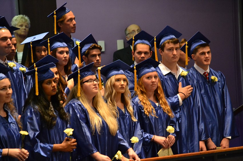 Students stand for the national anthem.