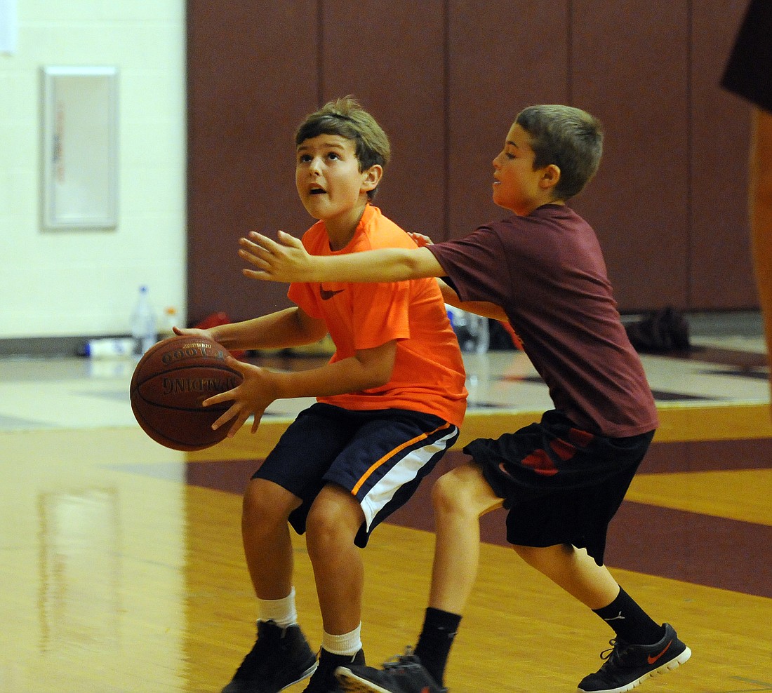 Tara Elementary fifth-grader Ty Moore and Braden River Elementary fourth-grader Carter Jula enjoyed playing one-on-one during last year's Braden River Basketball Camp.
