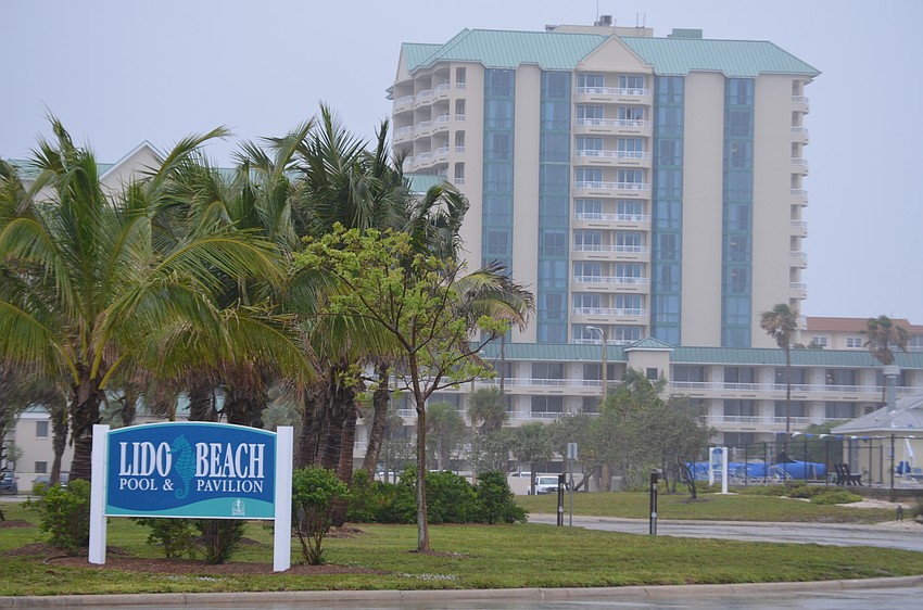 There were four cars in the parking lot at Lido Beach during the tropical storm Monday.