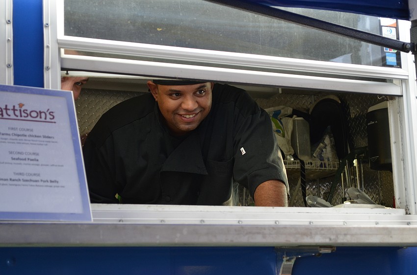 Alex Vazquez, of Mattison's, serves up food at the first week of Summer Chef Jam.