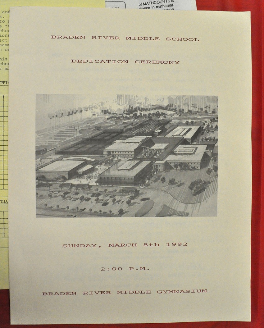 Jill Bergeron gathered momentos from the school's 25 years, including a program from its dedication ceremony in 1992.