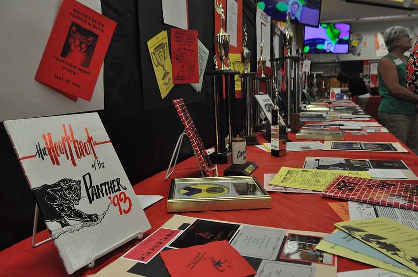 Jill Bergeron gathered momentos from the school's 25 years, including a program from its dedication ceremony in 1992.