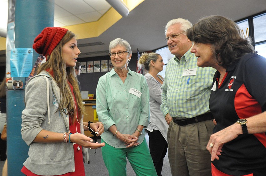 Ansley Shilling, who is graduating Braden River Middle this year, chats with retired science teacher Joe Brannon, his wife Mary, and ESE teacher Katy Kimbrell.