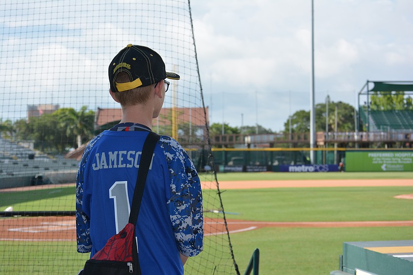 Caleb Jameson takes it all in as he enters the ball park.