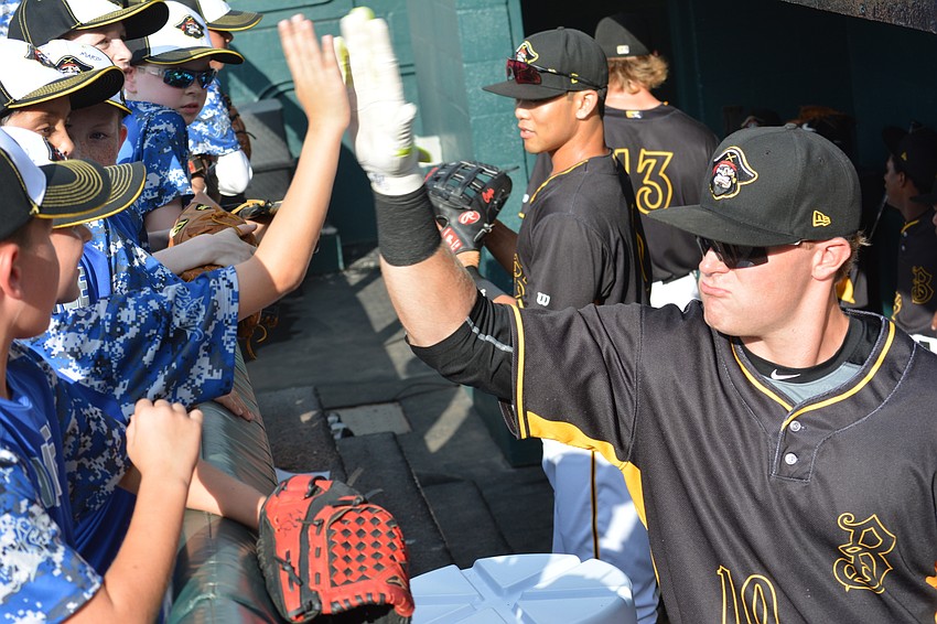 Marauder infielder Chase Simpson shows the all-stars some love from the dugout.