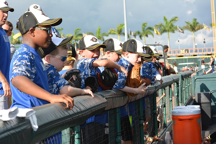 The Manatee Cal Ripken 8U All-Stars get a close look at the dugout.