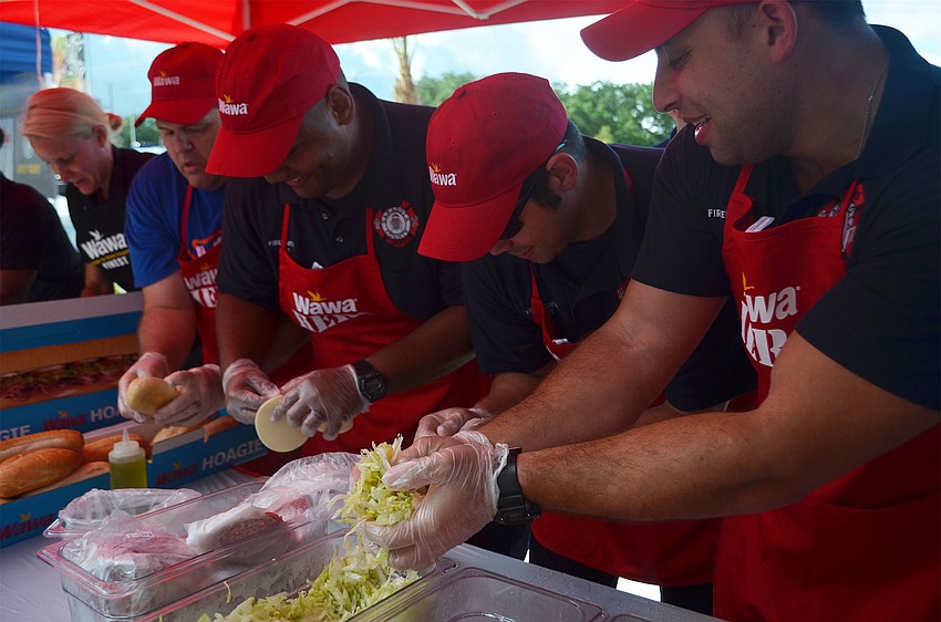 Sarasota firefighters competed against the Sarasota Police Department in a sandwich-making competition outside the Wawa station on North Washington Boulevard Thursday, June 9. The new location is Sarasota's first.