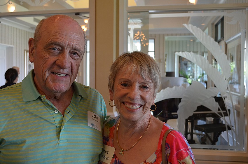 John and Anne Summers arrive to hear local meteorologist Bob Harrigan speak.