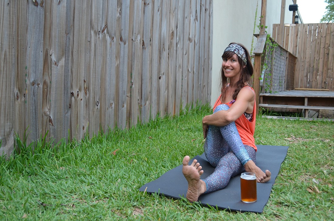Yoga instructor Meg Metcalf leads the Craft Beer and Yoga class at JDubâ€™s Brewing Co. in Sarasota.