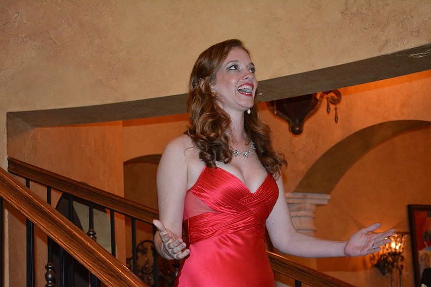 Kathryn Parks opens the entertainment portion of a fundraiser for The Players Centre for the Performing Arts by captivating the crowd with a song.