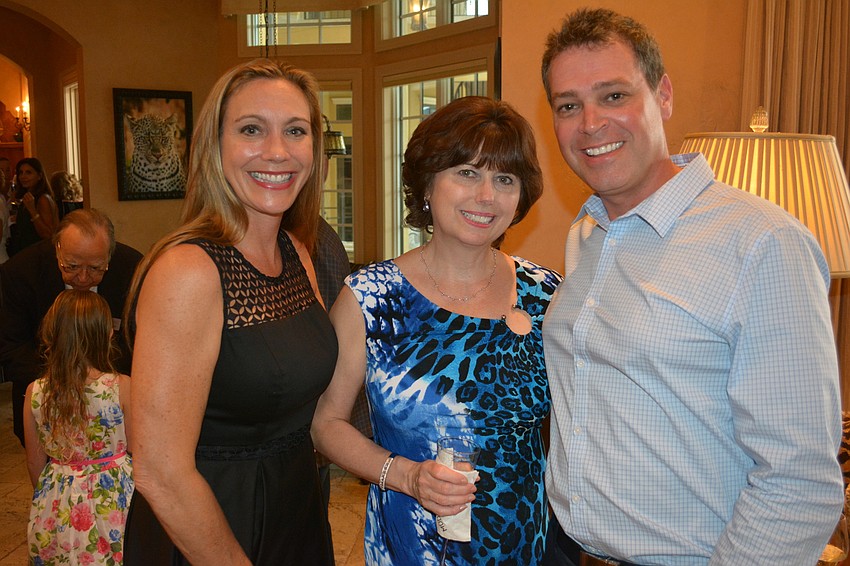 Drs. Michelle Scala-Frenchman and Shepherd Frenchman stand on either side of Joanna Vealey as all three came to support The Players Centre for the Performing Arts.