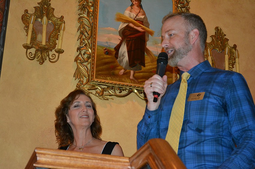 Michelle Bianchi Pingel, CEO of The Players Centre for the Performing Arts, looks on as Artistic Director Jeffrey Kin addresses the crowd at Lou and Ann Marie Marinaccio's home in Lakewood Ranch.