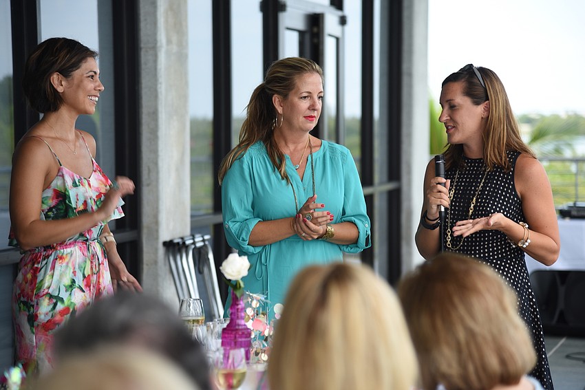 Co-Hosts Courtney Lauderdale and Nikki Logan-Curran with Mote's Stacy Alexander welcoming guests to the event.