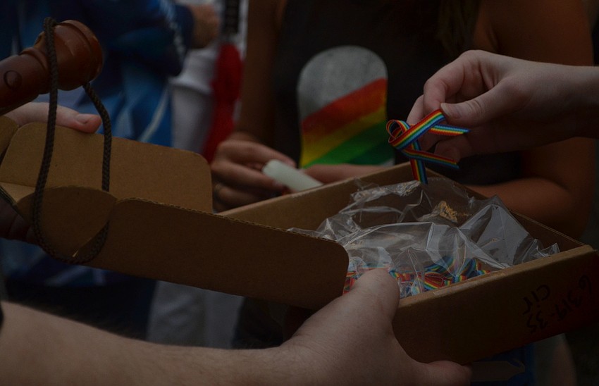 Rainbow ribbons were passed out at a vigil in Five Points Park in downtown Sarasota, Florida June 13, 2016. The vigil commemorated the victims of the Pulse Nightclub shooting.