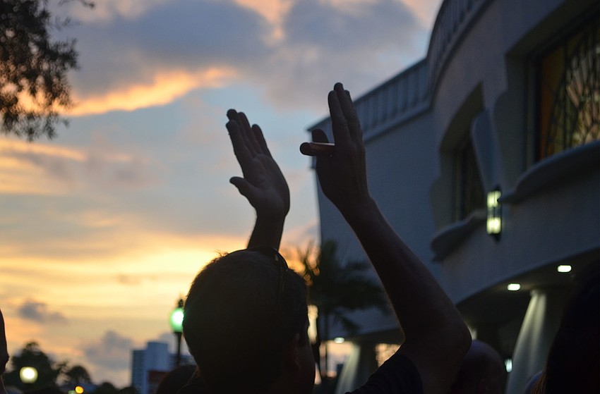 Scott Blackman holds a claps his statements following Jonathan Hall's speach on behalf of his friend, Edward Manuel Sotomayer, June 13, 2016 in Sarasota, Florida. 