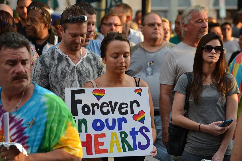 Sabina Murman shows her support during the vigil.