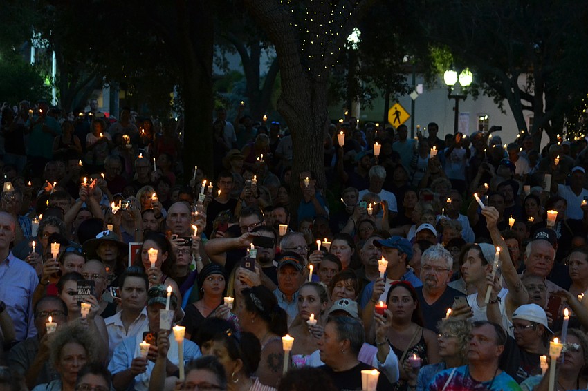 Thousands held lit candles during the vigil to honor the victims of the Pulse nightclub shooting in Orlando.