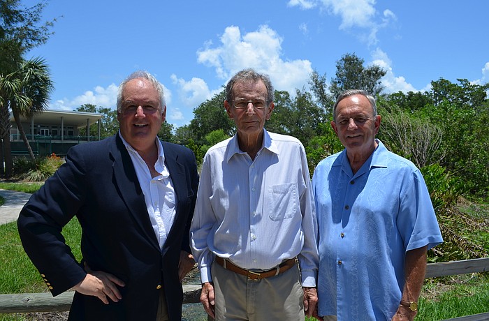 Tom Aposporos, David Brenner and Bob Simmons stand in front of â€” what they hope is â€” the future site of a black box theater.
