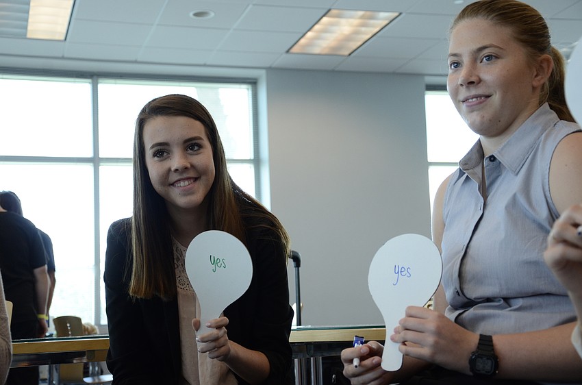 Sidney Oake and Caitlin Sollazzo, both of Lakewood Ranch High School, try to guess the right answer in Gastrointestinal Jeopardy.