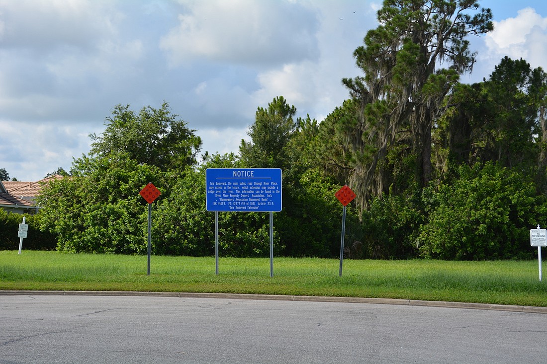 A sign at the southern end of Tara Boulevard indicates the bridge will come through one day.
