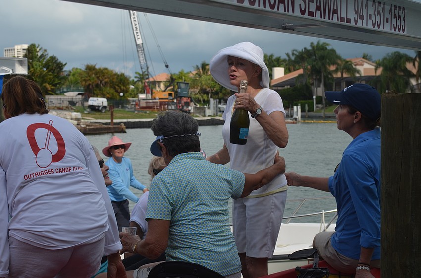 Commodore Lynn Smith christens the lift.