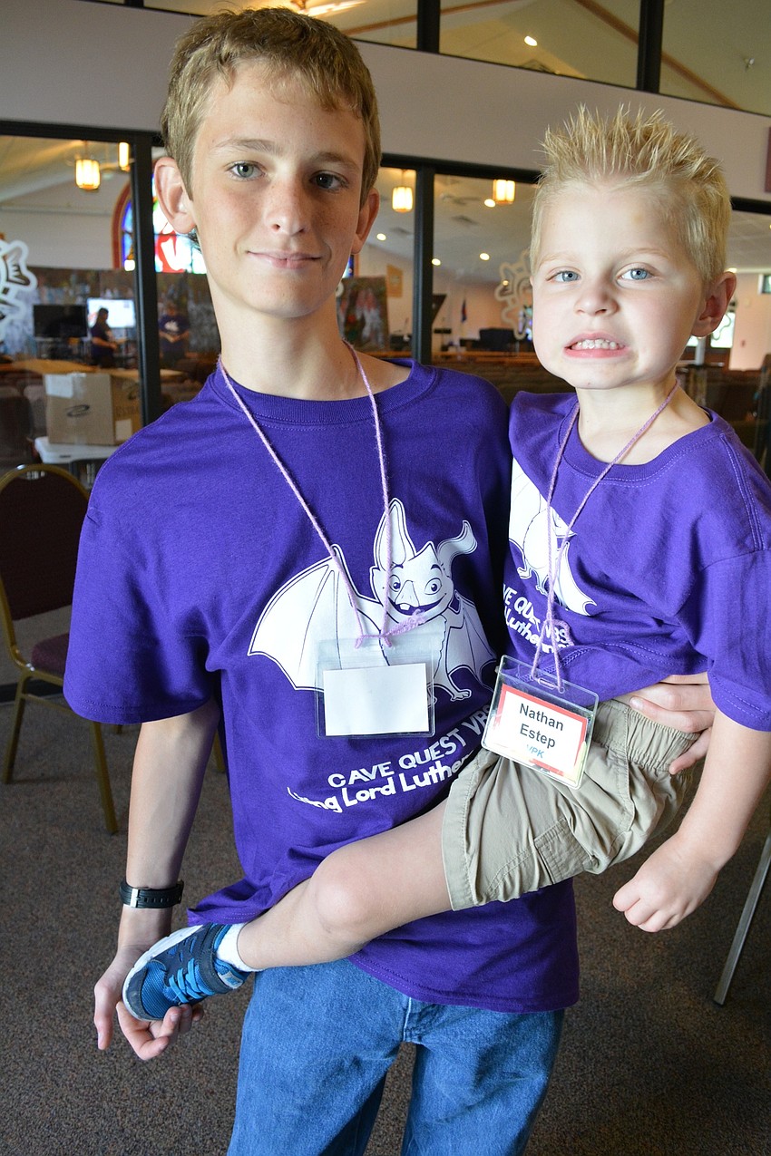 Connor Schrand, an upcoming freshman at Lakewood Ranch High School, hangs out with 3-year-old Nathan Estep.