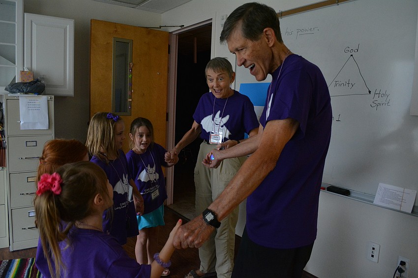 Volunteers Kathy and Gene Longsma share with the children how they can be filled with the Holy Spirit.
