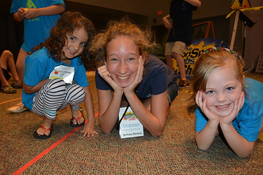 Sophia Weaver, student leader Bethany Dickman and Khloe Tankersley drop into a tucked position after they are hit by 