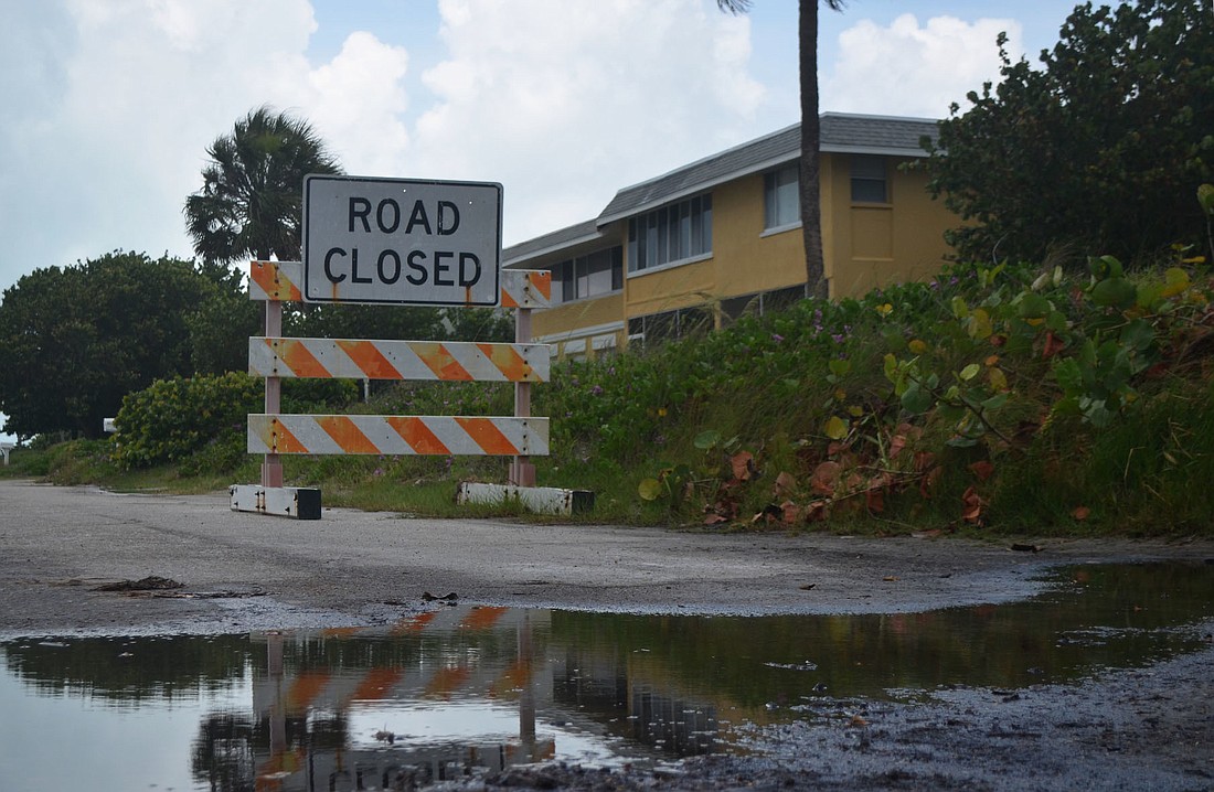 A weather-worn roadblock sits at the intersection of Beach Road and Columbus Boulevard blocking thru traffic to the northern portion of Beach Road June 17, 2016. Sarasota County granted petitioners request to permanently vacate the road May 11.