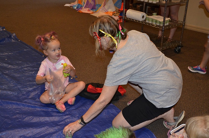 Grace Goudelock talks with Arlene Raterman during snacktime.