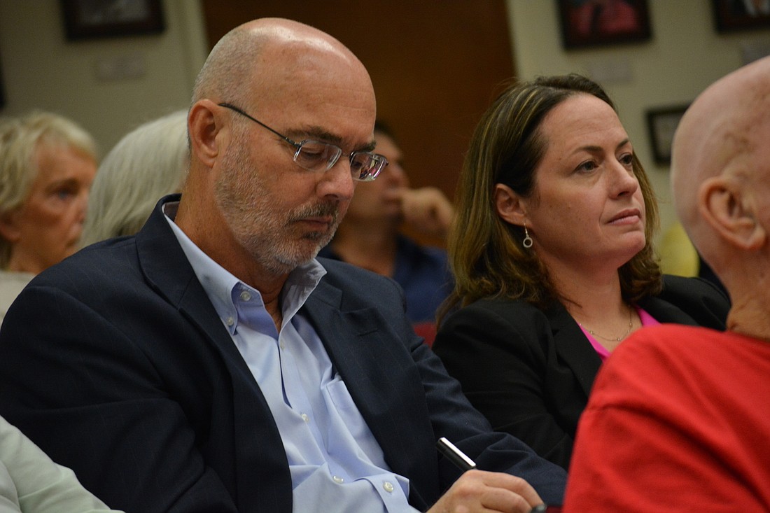 Town Manager Dave Bullock and Town Attorney Maggie Mooney-Portale await the Manatee County Commissionâ€™s decision on the half-cent sales tax.