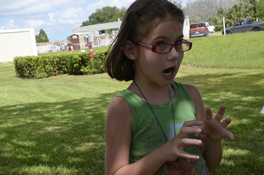 Courtney Springfield pretends to be a tiger.